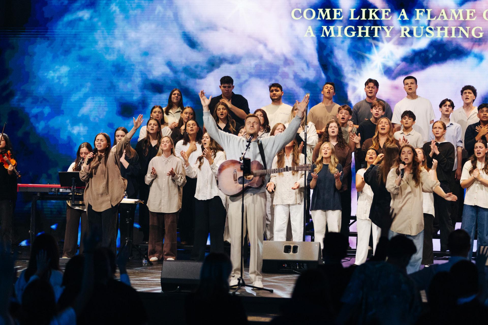 Congregation with raised hands during worship